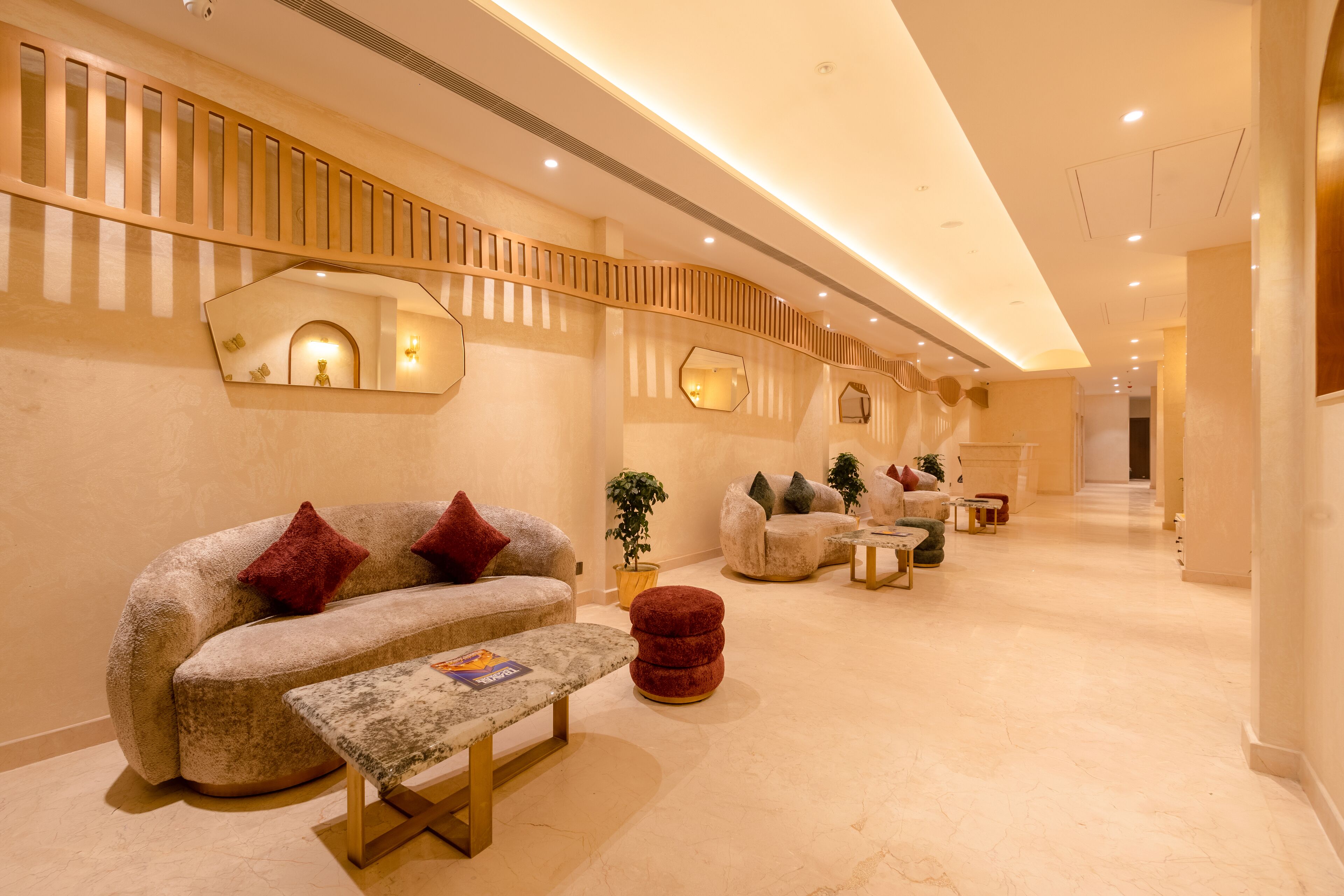 A modern interior with a sofa, ottoman, and a bench.