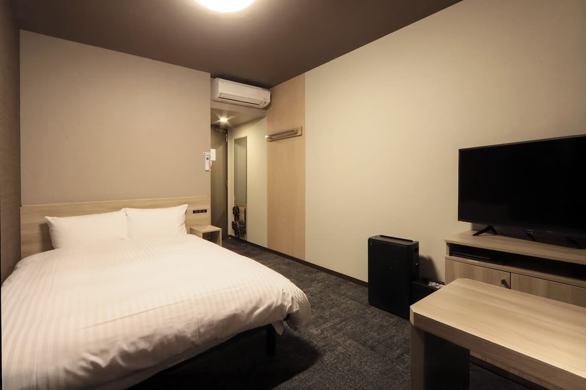 Room | Desk, laptop workspace, blackout drapes, iron/ironing board