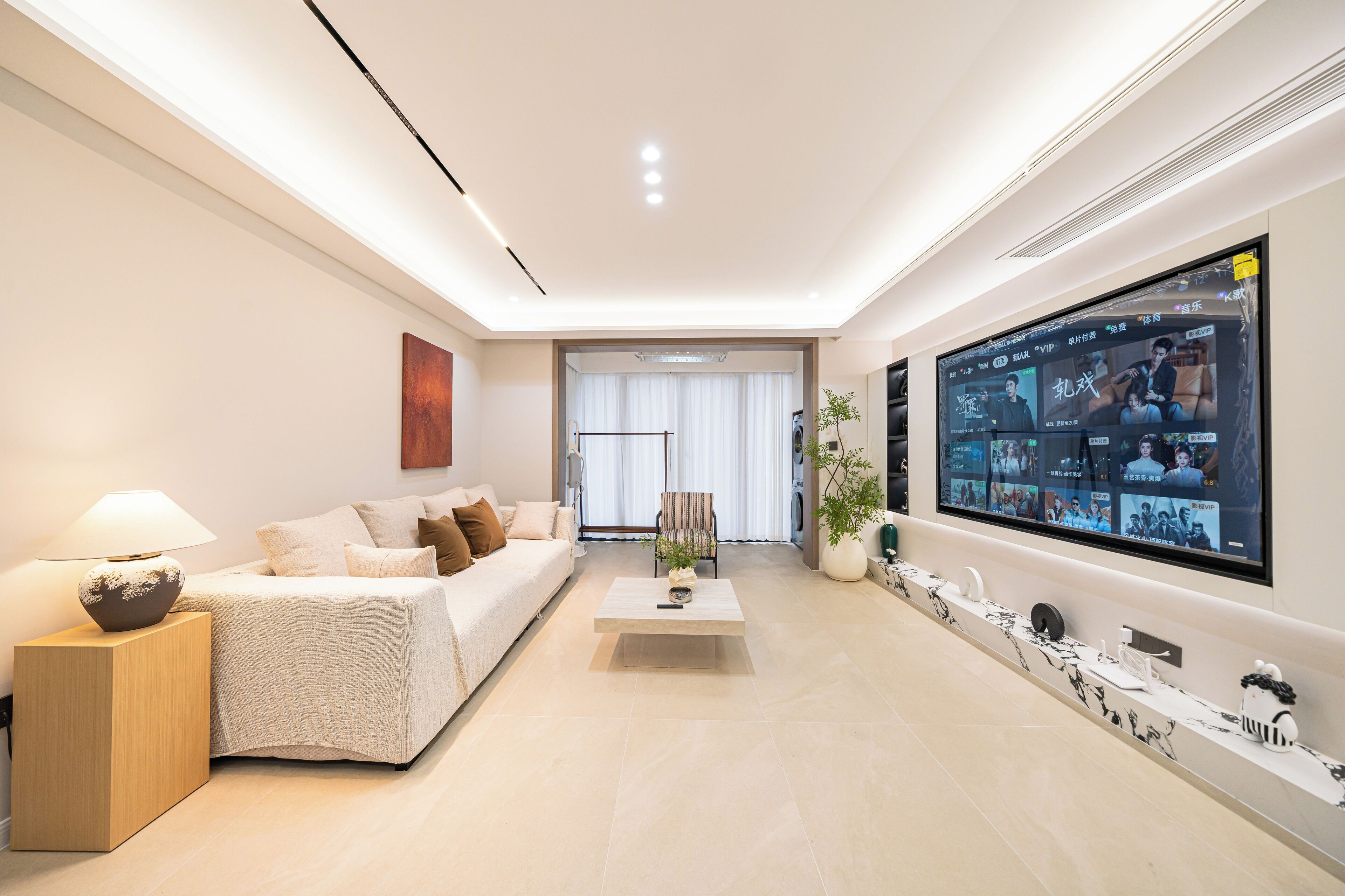 Deluxe Apartment | Living area | 100-inch Smart TV with digital channels