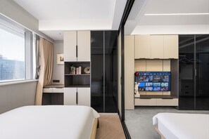 A modern hotel room with a bed, a desk, and a wardrobe. - Today Aparthotel (Shanghai)