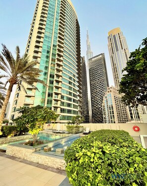 Outdoor pool - Upscale 1BR Loft Walk to Burj & Mall (Dubai)