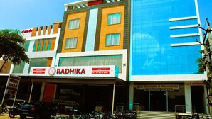 A multi-story building with a bakery and restaurant named Radhika. - Hotel Roop Highlights (Jaipur)