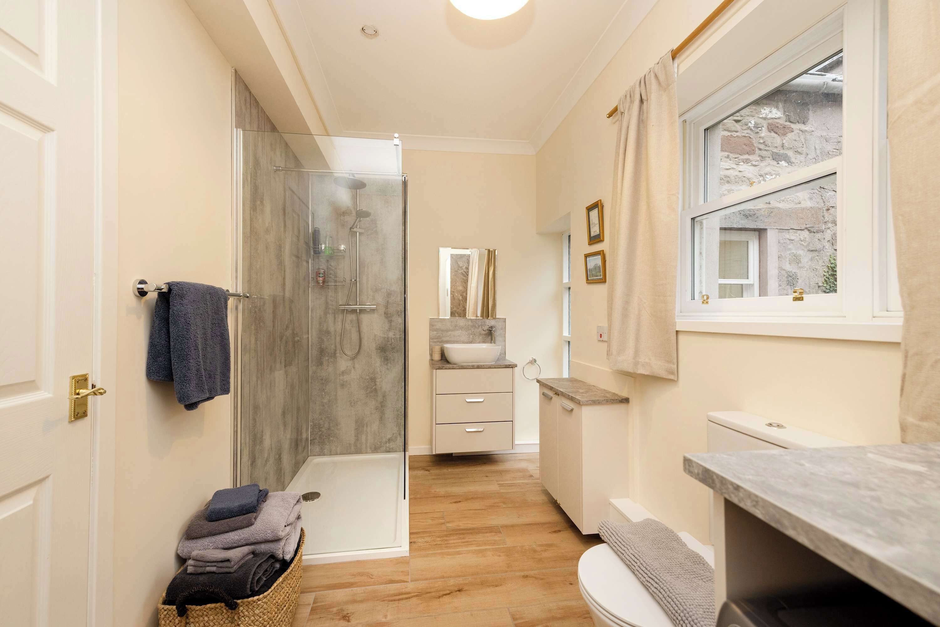 Shower, hair dryer, towels, shampoo