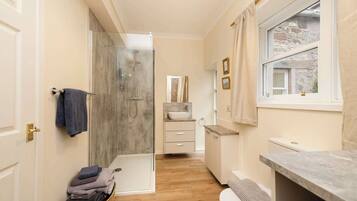 Shower, hair dryer, towels, shampoo