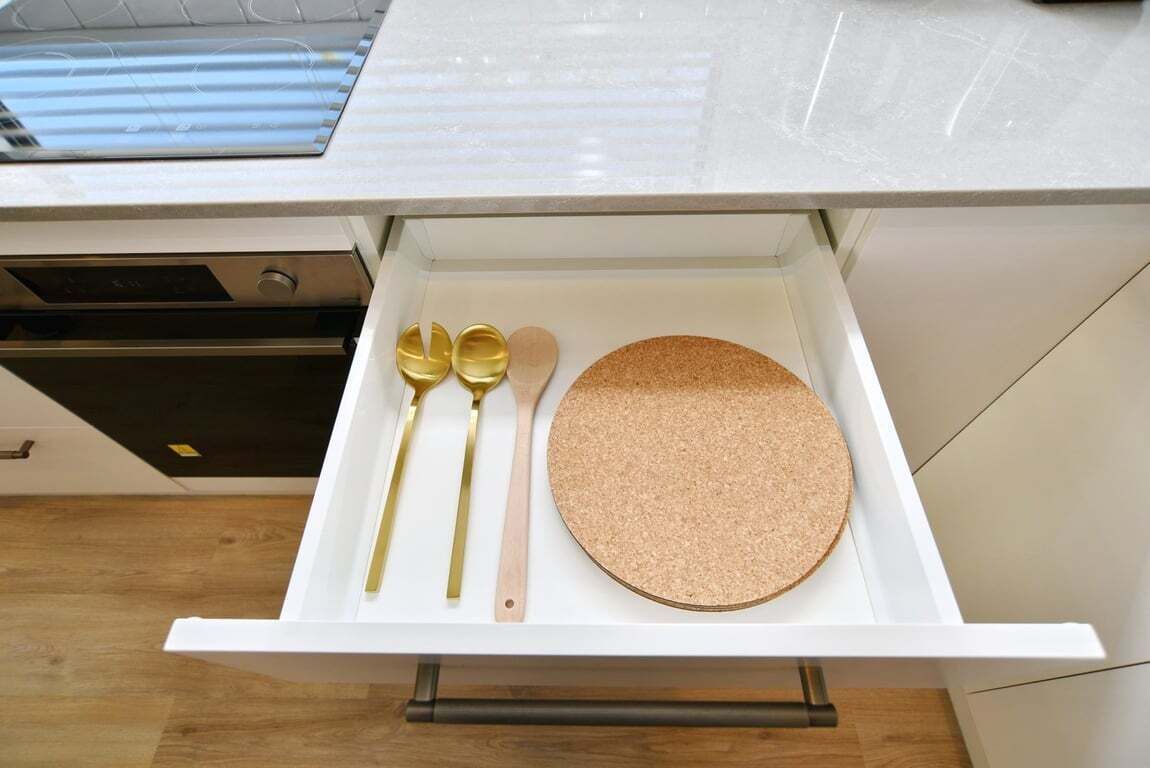 Fully equipped modern kitchen — oven, cooktop, fridge/freezer, dishwasher, kettle, toaster