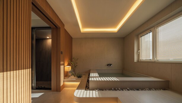 A modern bathroom with a built-in bathtub, wooden accents, and a skylight. - ONSHIMJAE (Pocheon)