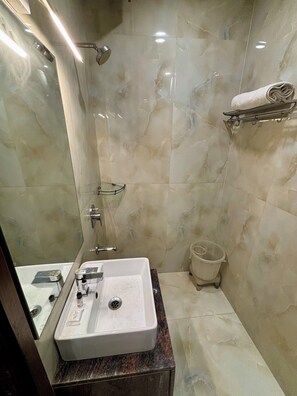Double Room, City View | Bathroom | Shower, towels, soap, shampoo - SATYAM ROOM (New Delhi)