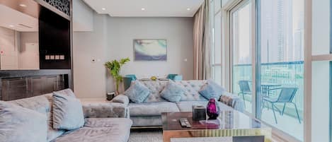 Deluxe Apartment, Balcony, City View | Living area | 55-inch Smart TV with digital channels