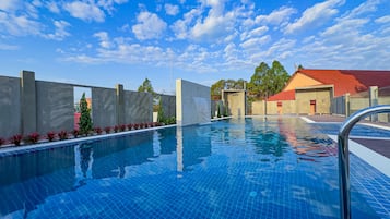 Outdoor pool, open 10:00 AM to 10:00 PM, pool umbrellas, pool loungers