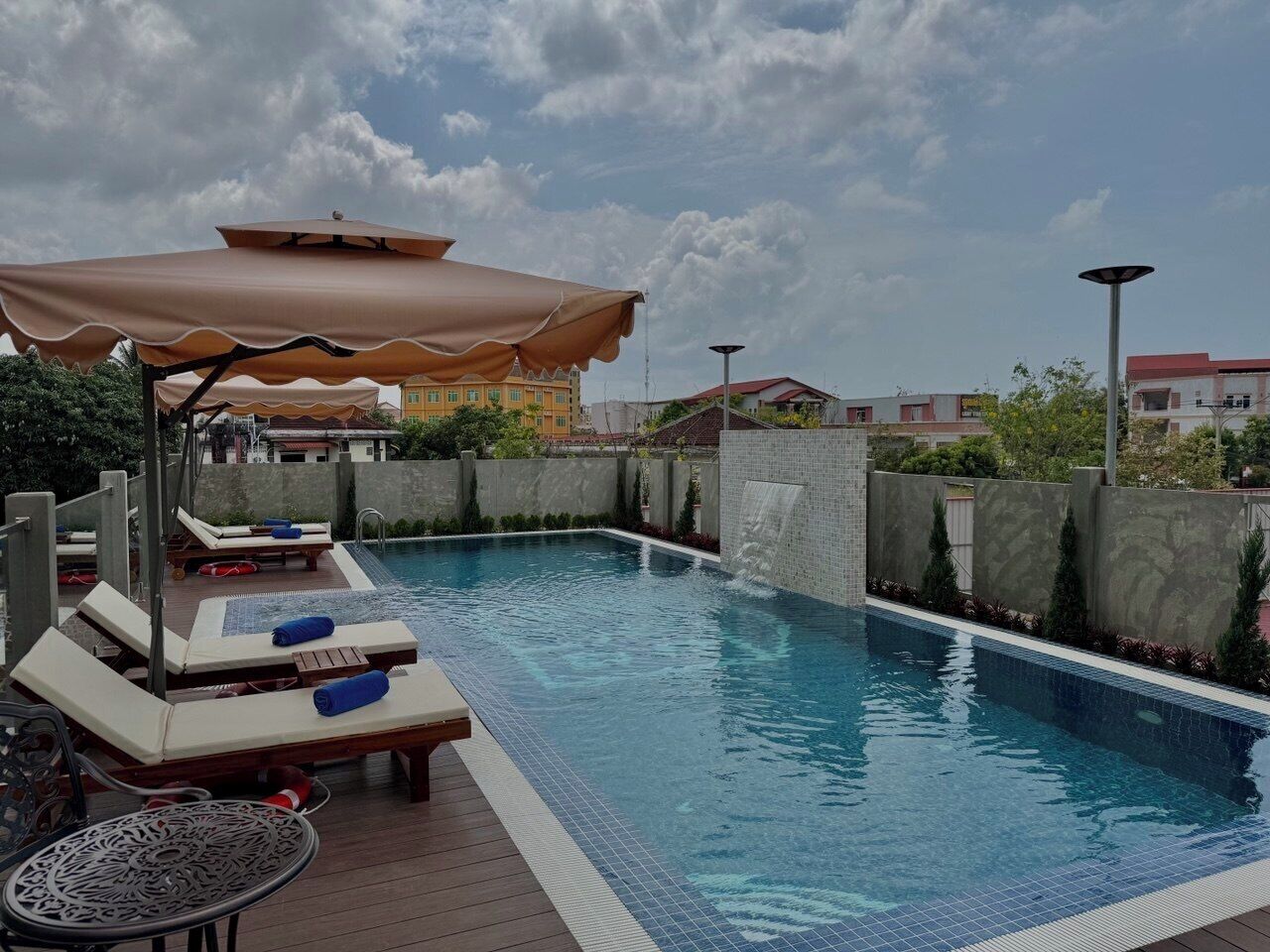 Outdoor pool, open 10:00 AM to 10:00 PM, pool umbrellas, pool loungers