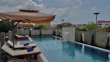 Outdoor pool, open 10:00 AM to 10:00 PM, pool umbrellas, pool loungers