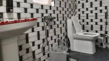 Quadruple Room | Bathroom | Shower, towels, toilet paper