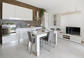 Deluxe Apartment, Sea View | Living area - Residence Moresca (Golfo Aranci)