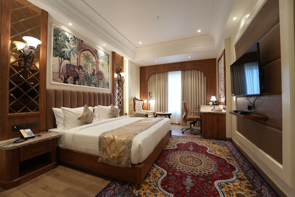 Luxury Suite, City View | Living area | 55-inch Smart TV with satellite channels