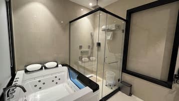 Business Suite, City View | Bathroom | Shower, free toiletries, hair dryer, slippers