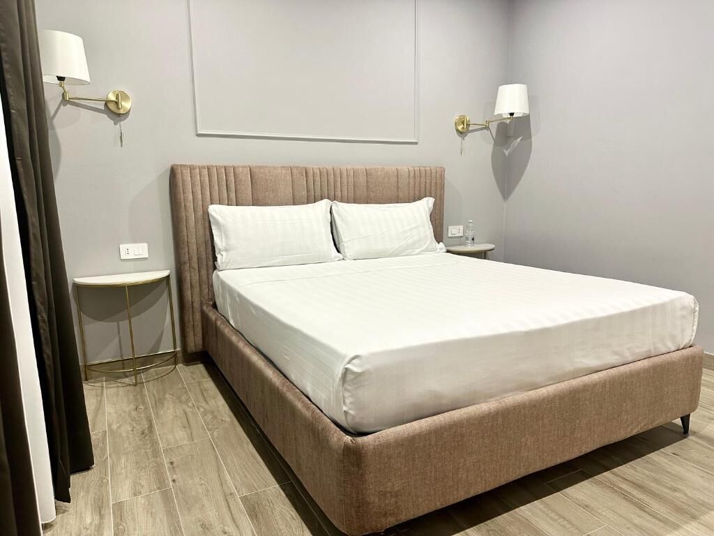 Deluxe Apartment, Balcony, Garden View | Minibar, in-room safe, desk, soundproofing