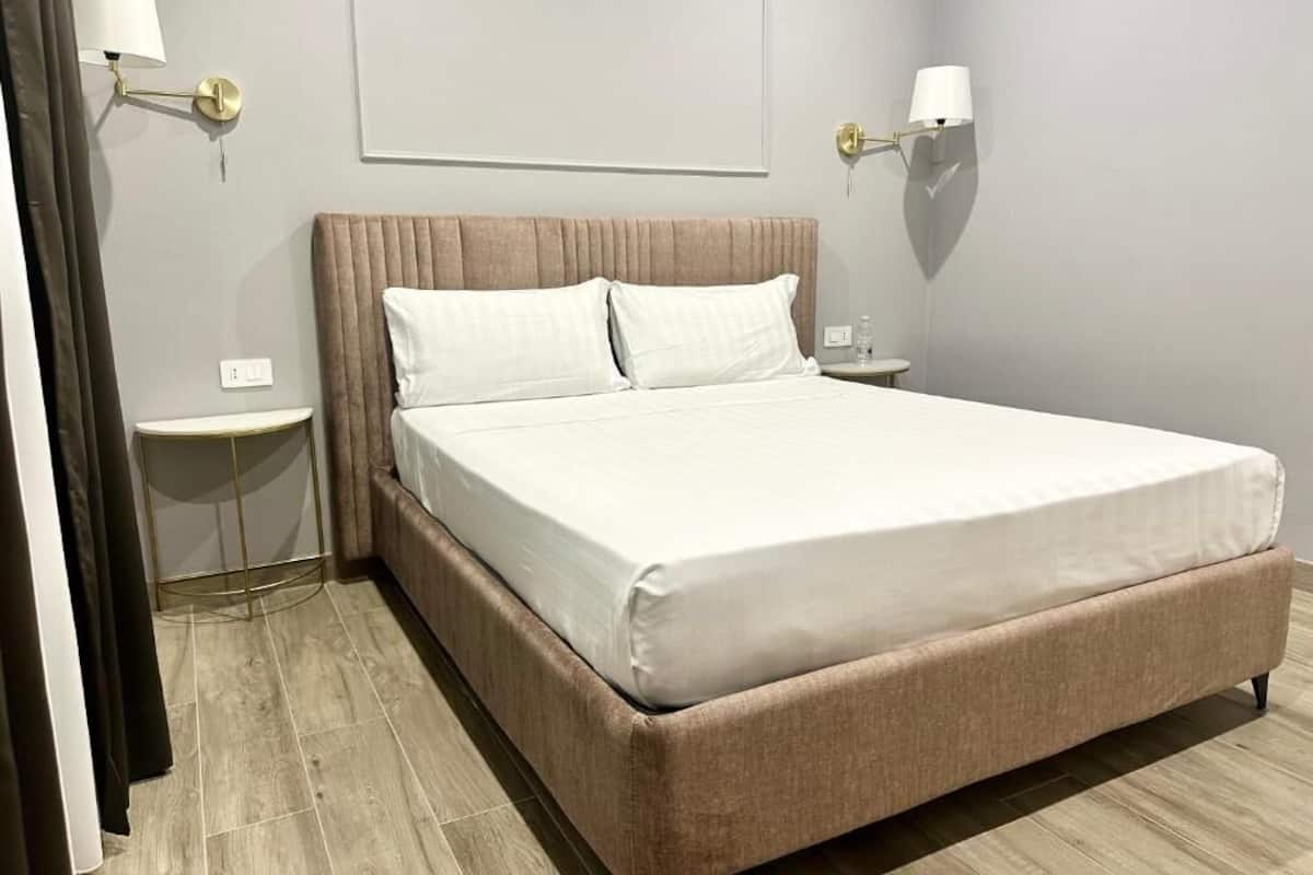 Deluxe Apartment, Balcony, Garden View | Minibar, in-room safe, desk, soundproofing