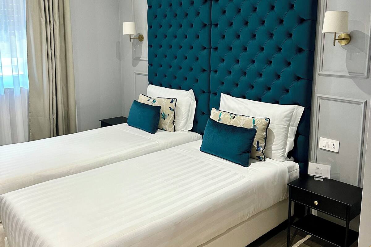 Deluxe Twin Room, Garden View | In-room safe, desk, soundproofing, iron/ironing board