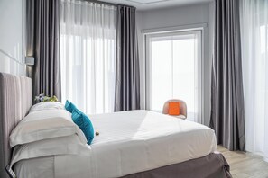 ดีลักซ์อพาร์ทเมนท์, ระเบียง, วิวสวน | ผ้าปูที่นอน Frette จากอิตาลี, เครื่องนอนระดับพรีเมียม, มินิบาร์