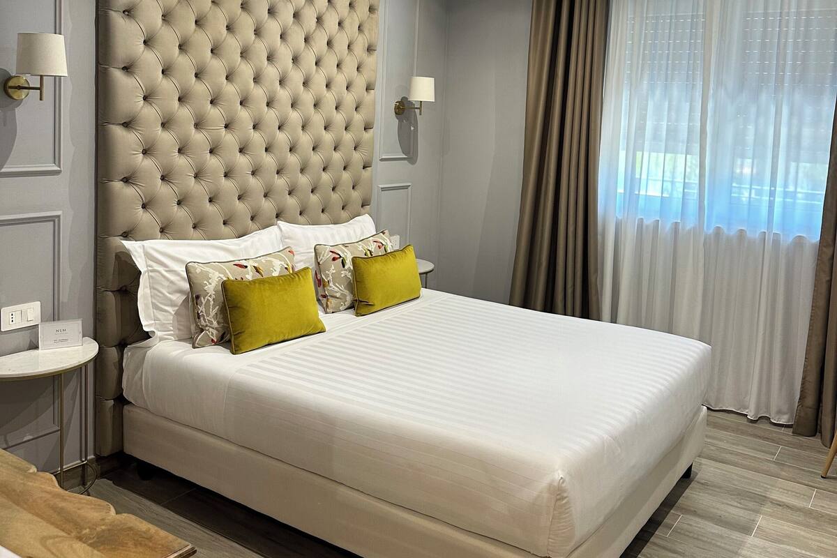 Deluxe Room, Garden View | In-room safe, desk, soundproofing, iron/ironing board