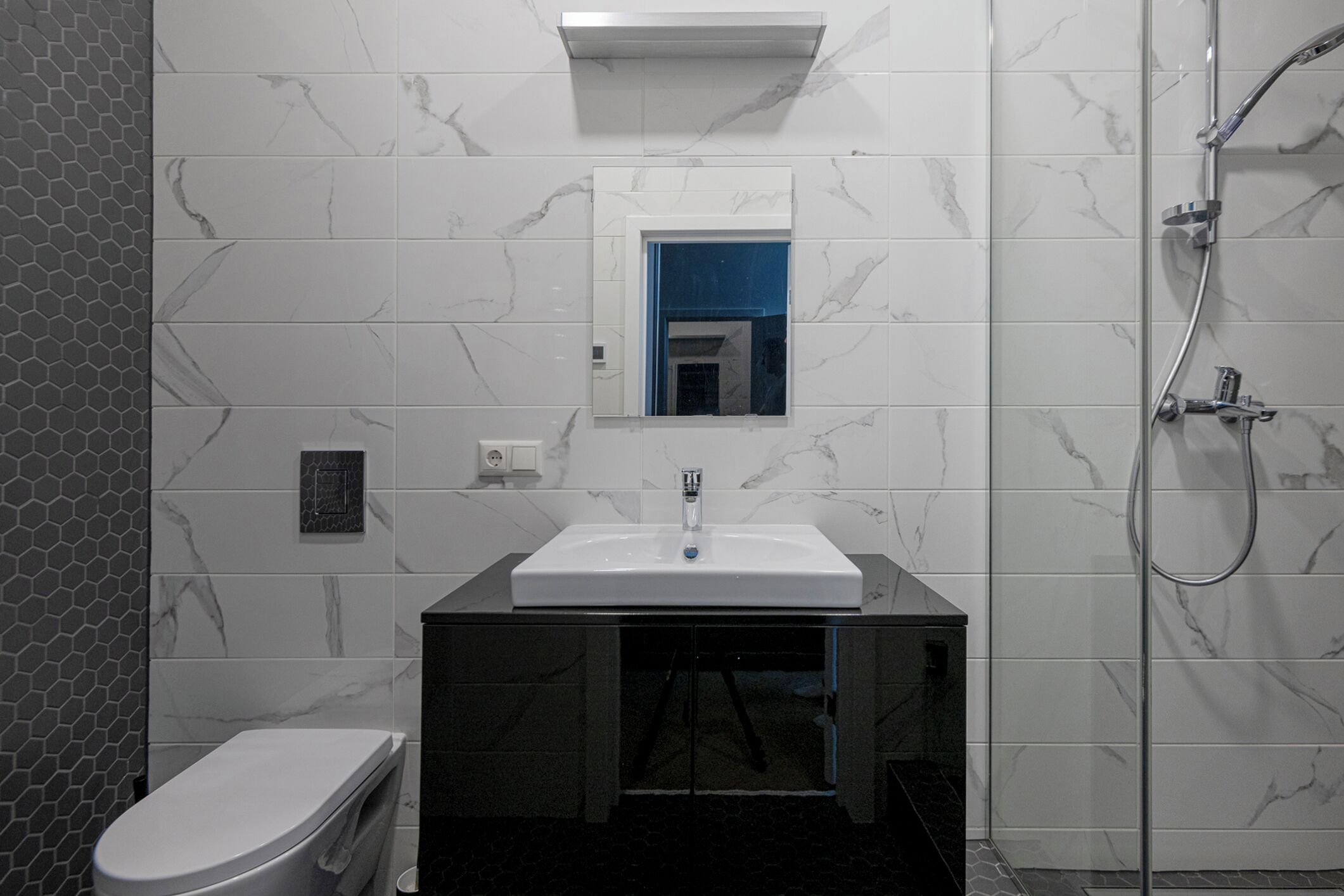 Shower, hair dryer, towels, toilet paper