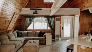 Living area - Northern MI Secluded A-Frame Cabin: ORVs, Fish/Hunt, Projector, Golf, EV, Pool (Grayling)