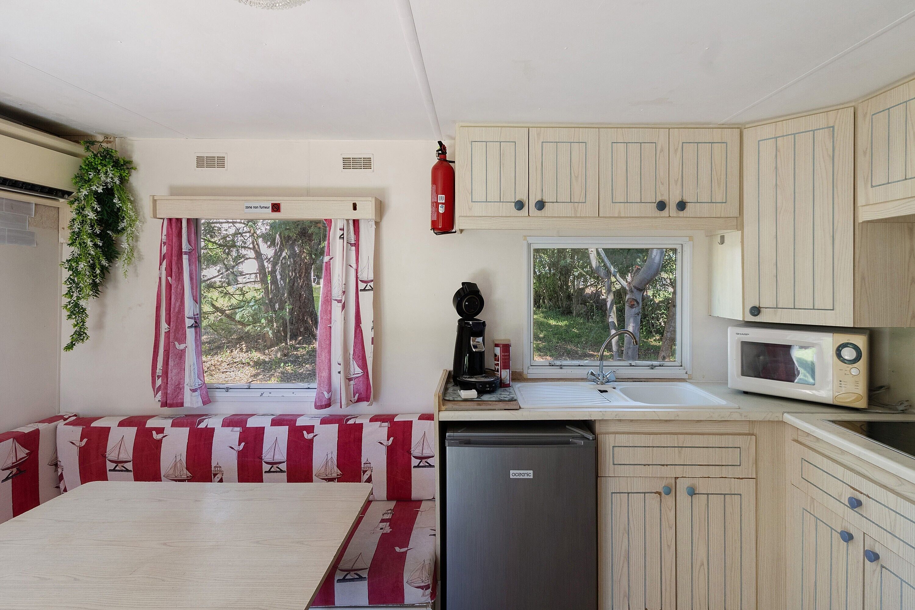 Fridge, microwave, stovetop, coffee/tea maker