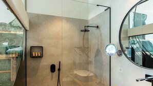 A modern bathroom with a glass-enclosed shower, a wooden vanity, and a large mirror. - Barefoodgiulia (Hasselt)