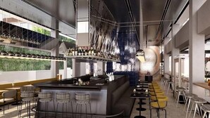 A modern bar area with a curved counter, bar stools, and a seating area with tables and chairs. - Dizengoff 99 by Isrotel Design (Tel Aviv)