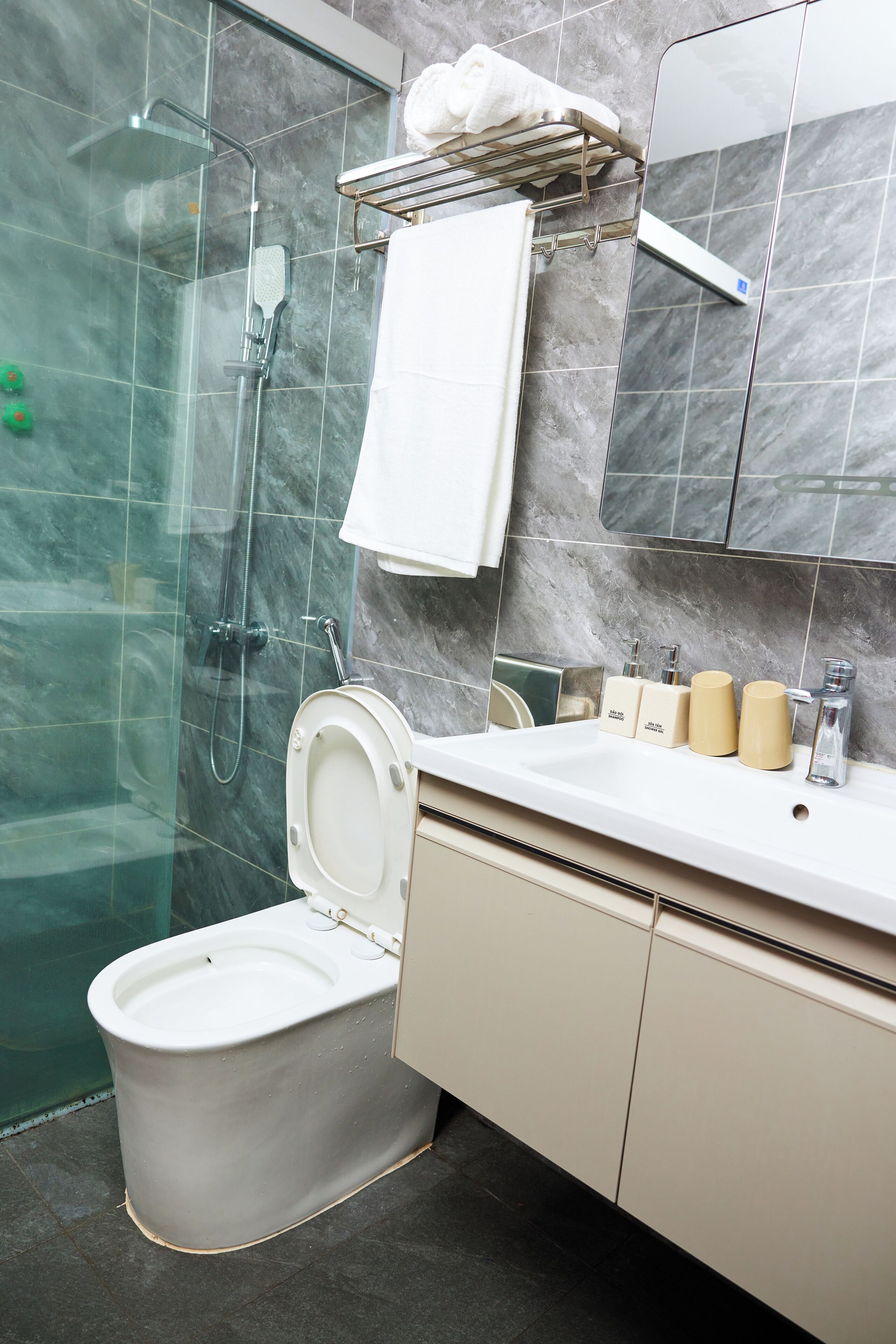 Shower, hair dryer, slippers, towels