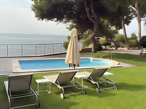 Chalet en bord de mer avec piscine, cuisine extérieure, grand jardin et vues exceptionnelles