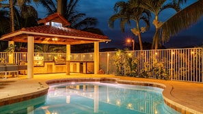 A swimming pool with a covered barbecue area, surrounded by a fence and palm trees. - 8k+ SF Mansion Cinema/Pool/Game Room (Plantation)