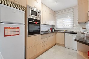 Fridge, microwave, oven, stovetop - RDR516 - Sea View Apartment with Pool in Cala de Mijas (La Cala de Mijas)