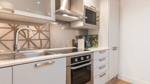 Fridge, microwave, oven, stovetop - 1BDR w/ Terrace in Alfama Centre by LovelyStay (Lisboa)