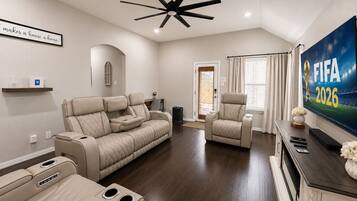 Smart TV, fireplace, books, stereo