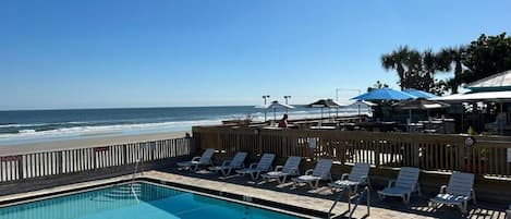 Outdoor pool, open 7:00 AM to 9:00 PM, pool loungers
