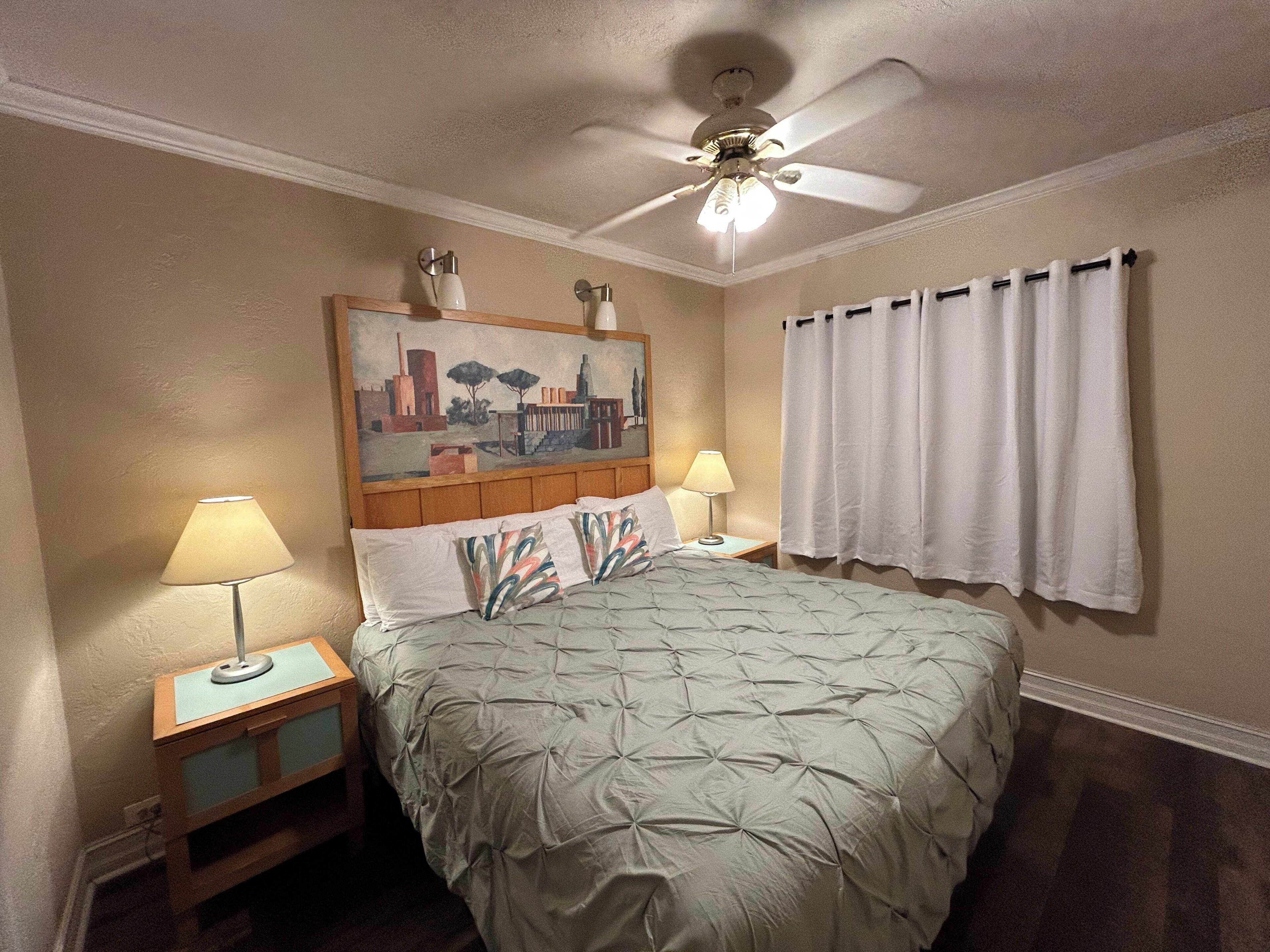 Desk, laptop workspace, bed sheets