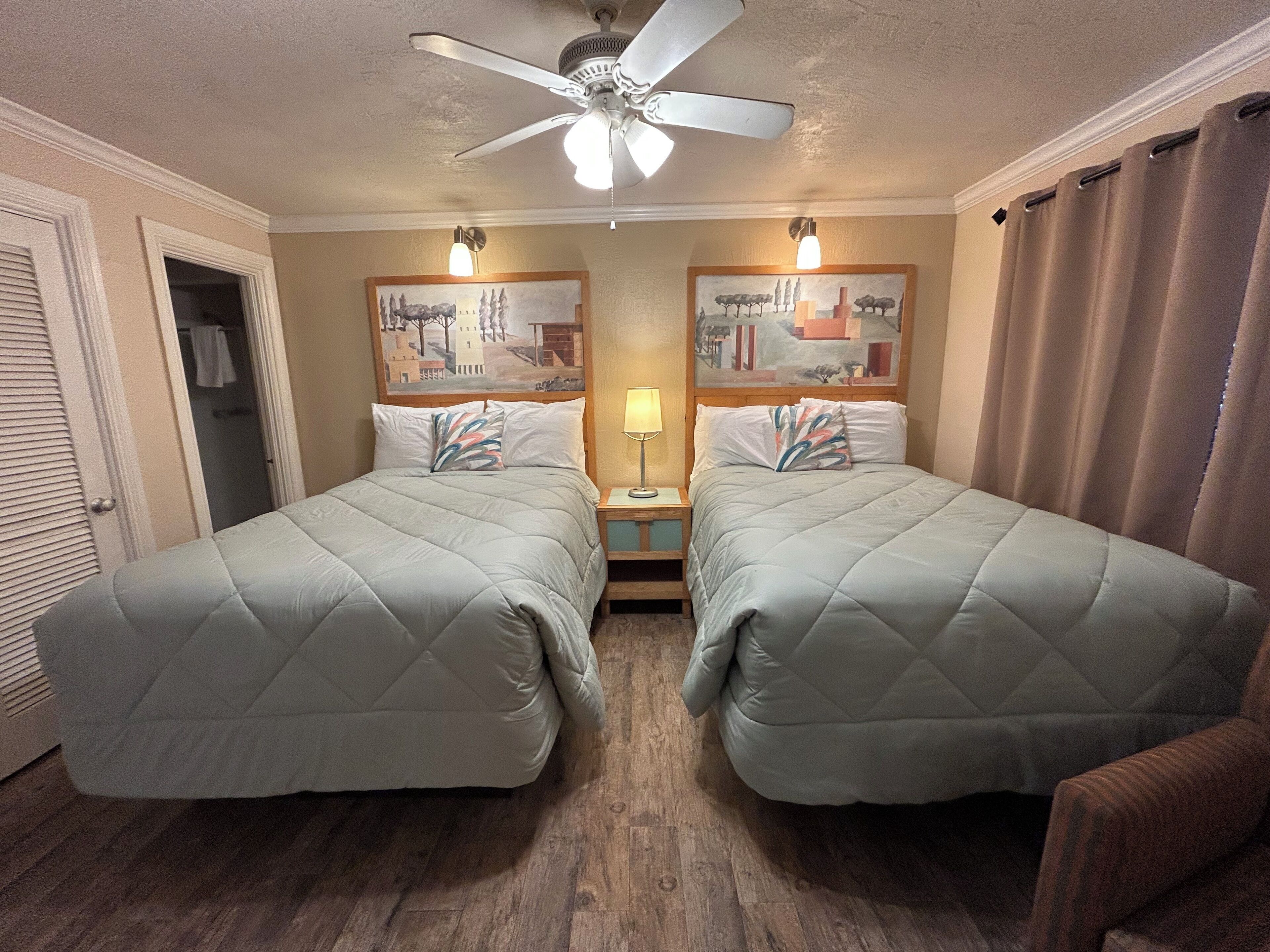 Desk, laptop workspace, bed sheets