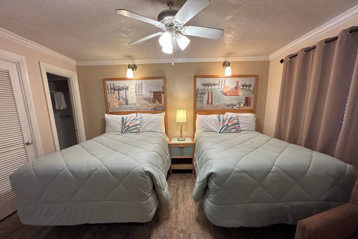 Desk, laptop workspace, bed sheets