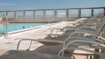 Outdoor pool, open 7:00 AM to 9:00 PM, pool loungers