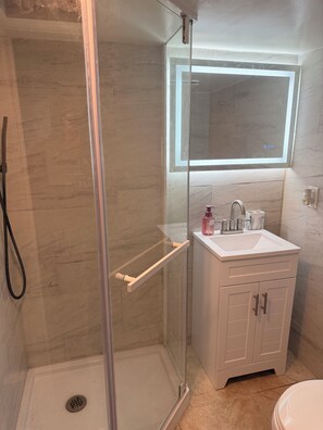 Shower, hair dryer, towels, soap