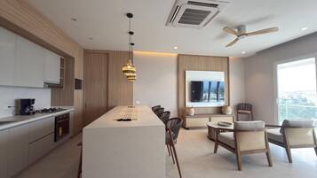 Deluxe Apartment, Balcony, Sea View | Living area