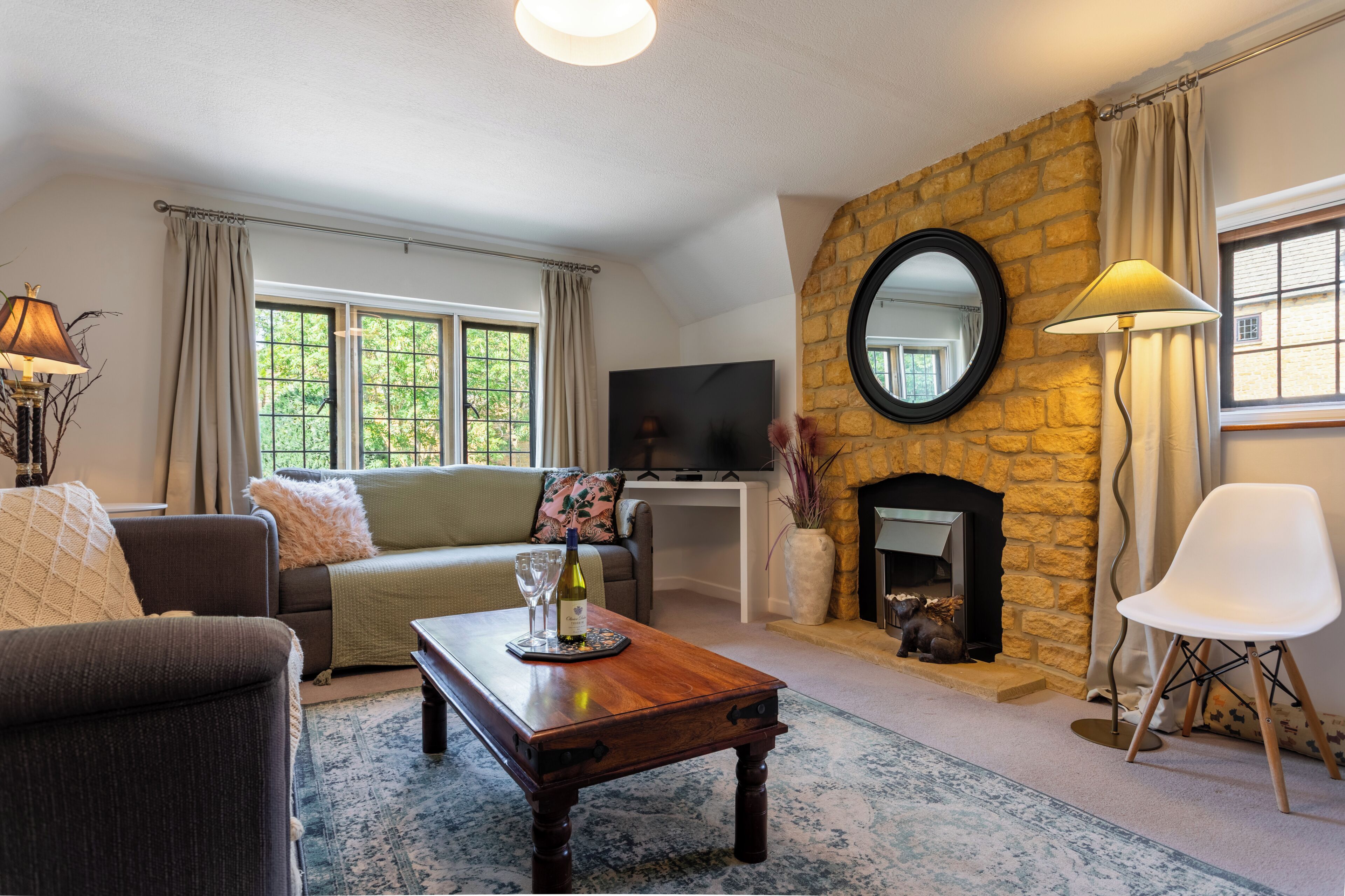 Smart TV, fireplace, books, computer monitors