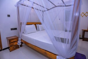 Deluxe Double Room, Garden View | Desk, laptop workspace, free WiFi