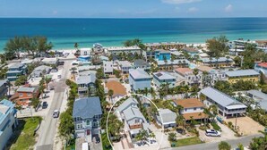 A coastal residential area with houses, a road, and a beach. - Beach Bungalow- 2 min walk to beach! Heated Pool (Bradenton Beach)