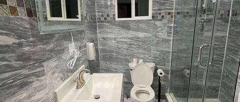 Shower, hair dryer, towels, soap
