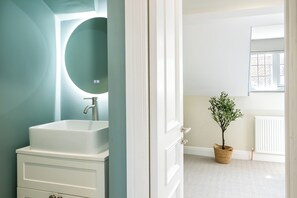 Shower, towels, soap, toilet paper