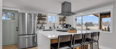 Fridge, stovetop, dishwasher, coffee/tea maker