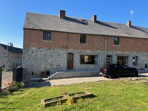 Exterior - An old-fashioned farmhouse surrounded by animals. (Marbaix)