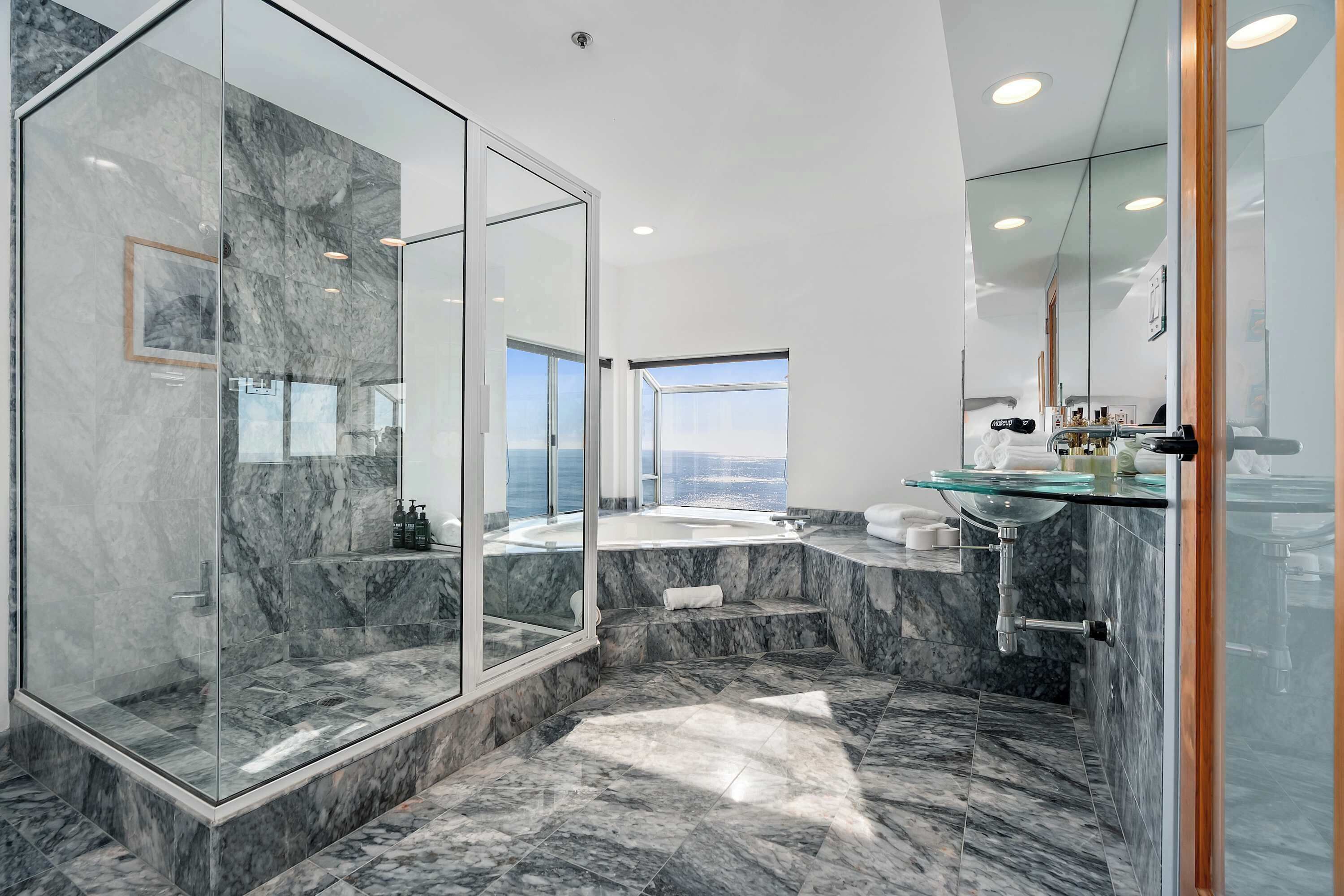 Shower, hair dryer, towels, shampoo